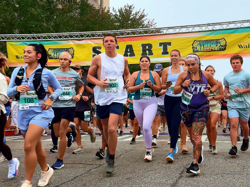 Runners at the start line for AthHalf 2024