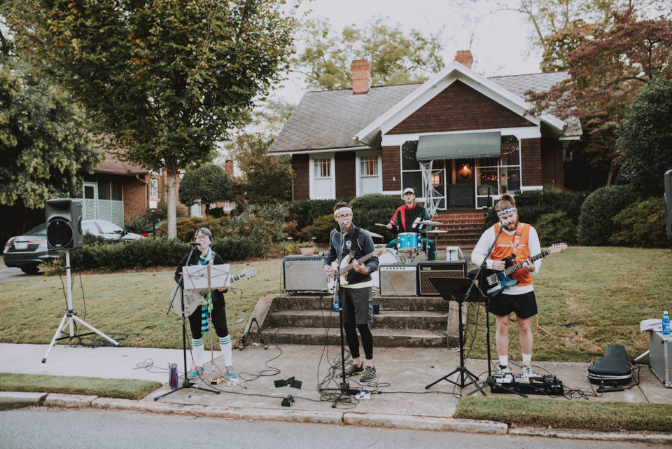 Band performing outside a house